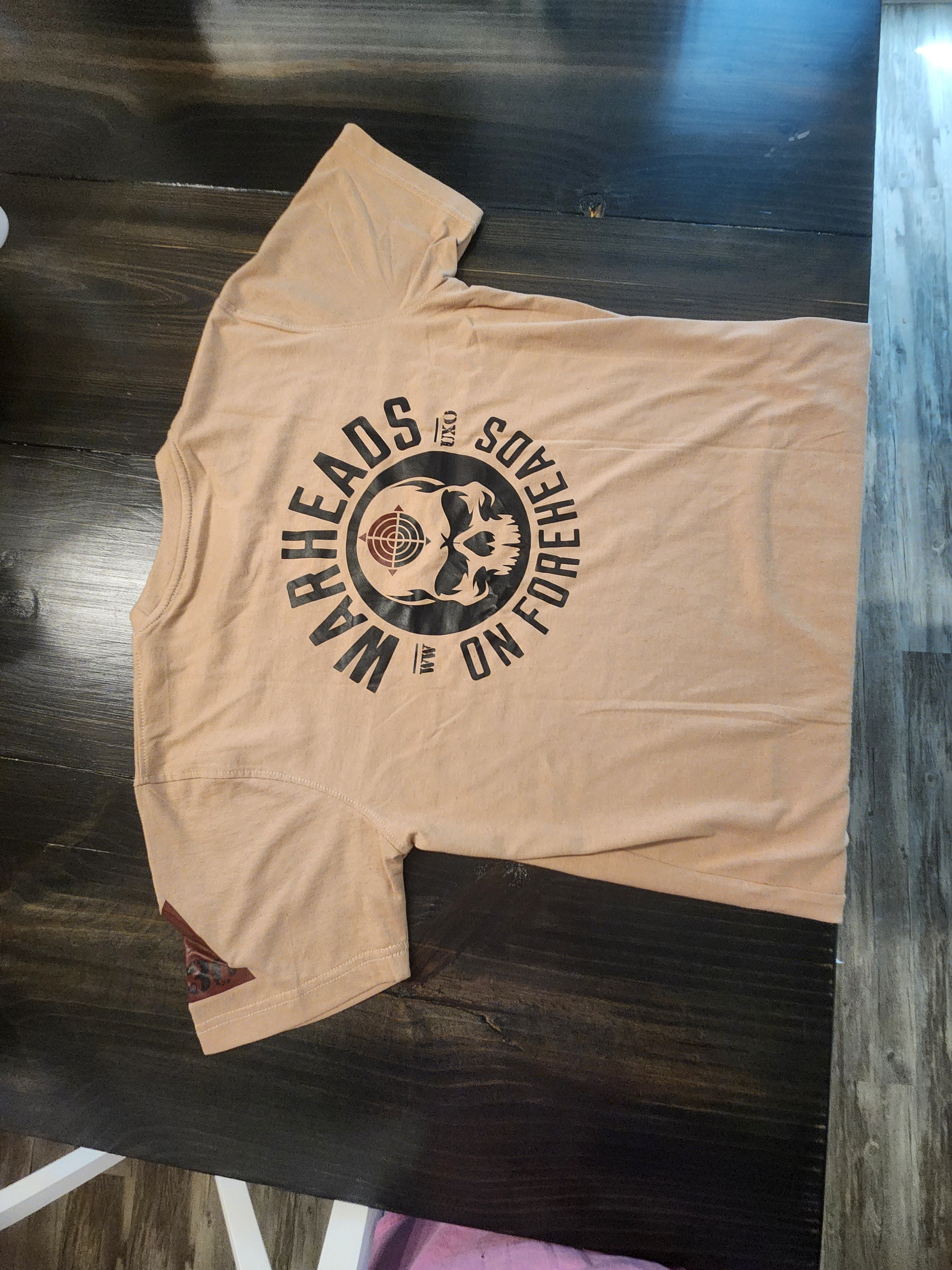 TAN WARHEADS ON FOREHEADS